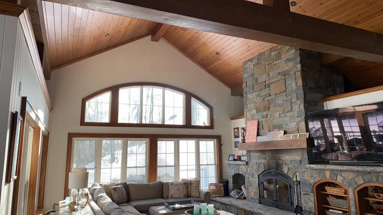 Luxurious Muskoka living room with custom wood finishes – completed in 2023 by Gonneau Building Group