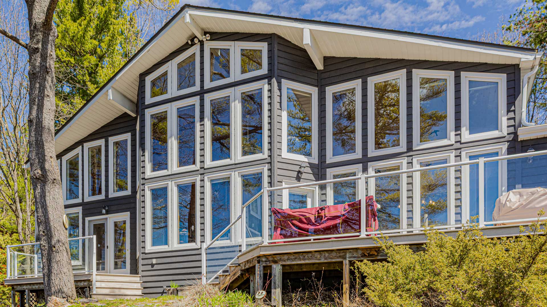 Cottage on Loon Lake Road in Gravenhurst Ontario restored after years of ice dam damage to the walls floors and windows by Gonneau Building Group