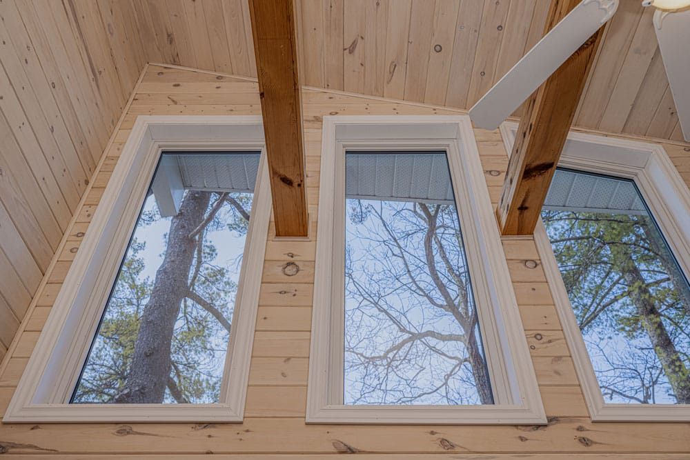 Repaired window frame in a Gravenhurst cottage after ice dam moisture damage with wall cavities dried inspected and sealed before finishing